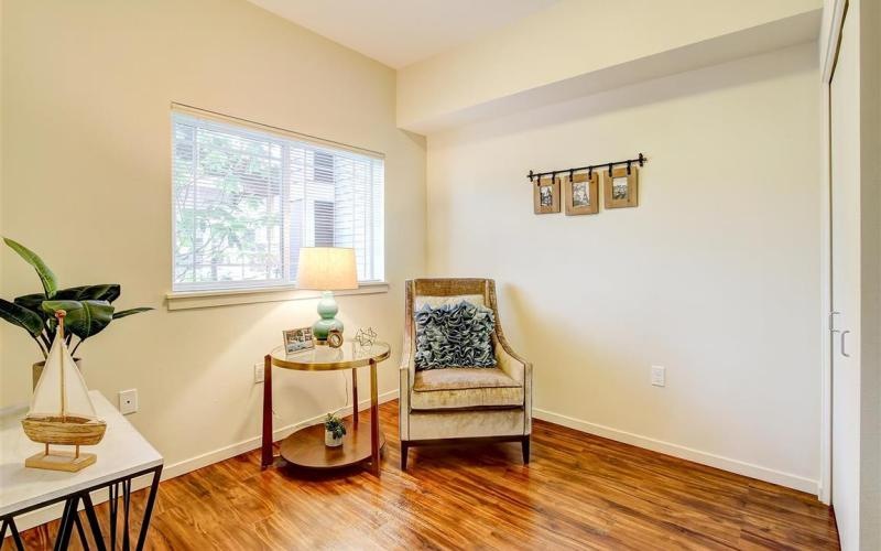 a living room with a chair and a table